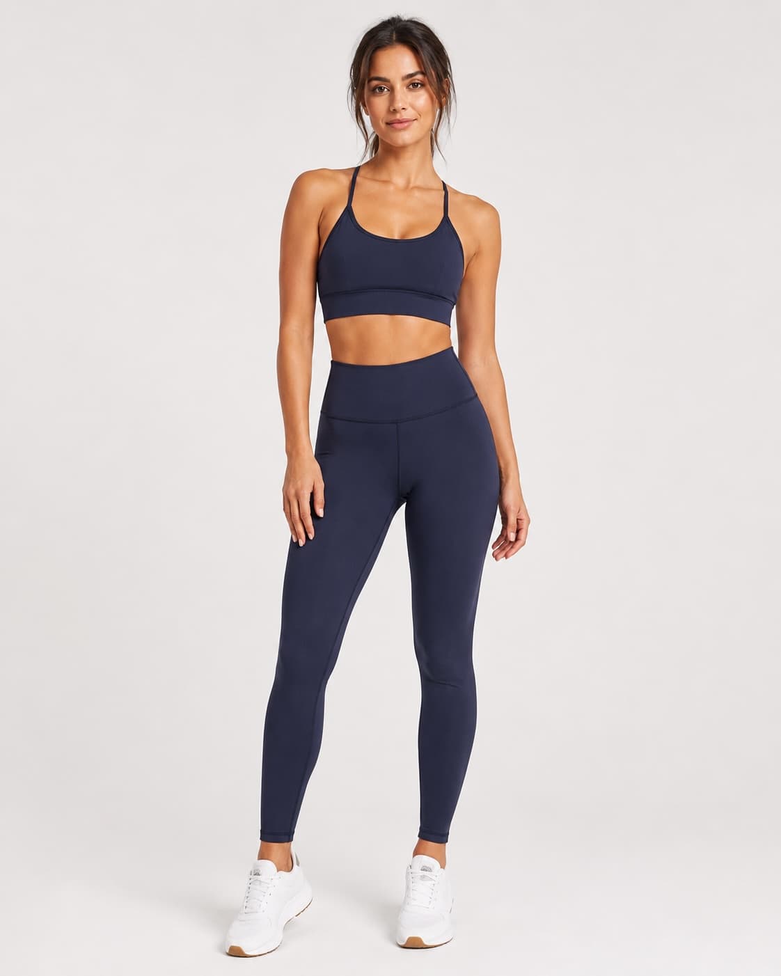 Navy sports bra and high-waisted leggings